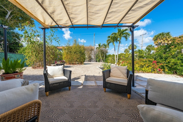 view of patio featuring an outdoor hangout area and a pergola