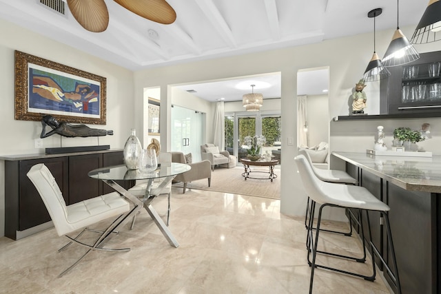 dining space with marble finish floor and visible vents