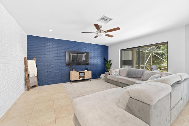 living area with recessed lighting, visible vents, a ceiling fan, brick wall, and tile patterned floors