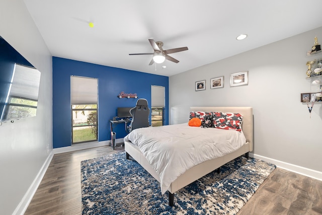 bedroom featuring recessed lighting, ceiling fan, baseboards, and wood finished floors