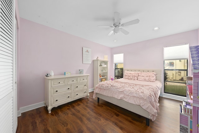 bedroom featuring dark wood-type flooring, multiple windows, recessed lighting, and baseboards