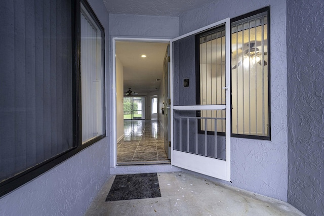 entrance to property with stucco siding