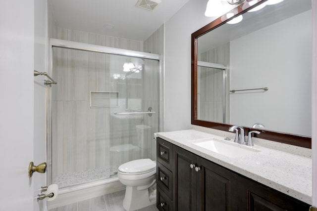 full bath featuring toilet, a stall shower, visible vents, and vanity