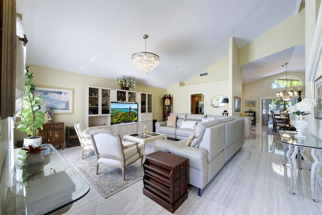 living room with a chandelier, light marble finish floors, and high vaulted ceiling