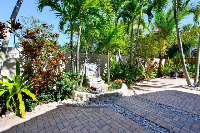 view of patio / terrace featuring fence