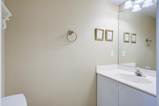 bathroom with toilet and vanity