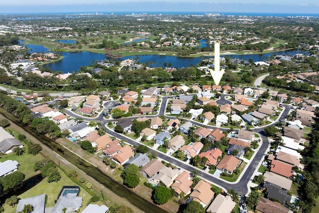 bird's eye view with a water view and a residential view