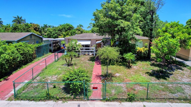 view of front facade with a fenced front yard and a gate