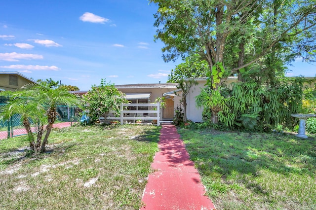 exterior space featuring fence and stucco siding