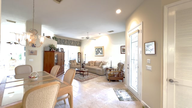 dining room with ceiling fan with notable chandelier, recessed lighting, light tile patterned flooring, and visible vents