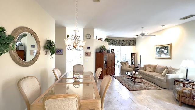 dining room featuring visible vents, light tile patterned floors, and ceiling fan with notable chandelier