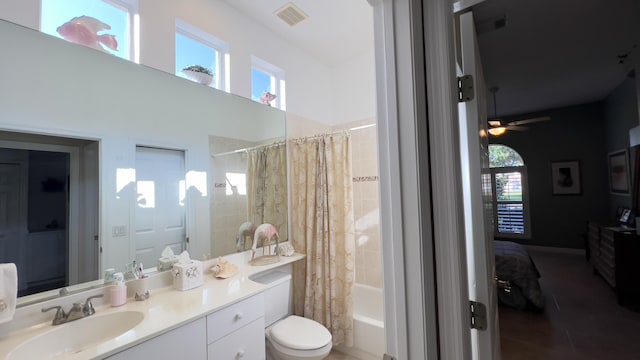 ensuite bathroom with vanity, plenty of natural light, toilet, and visible vents