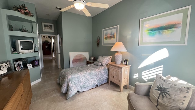 tiled bedroom featuring a ceiling fan, baseboards, visible vents, and vaulted ceiling