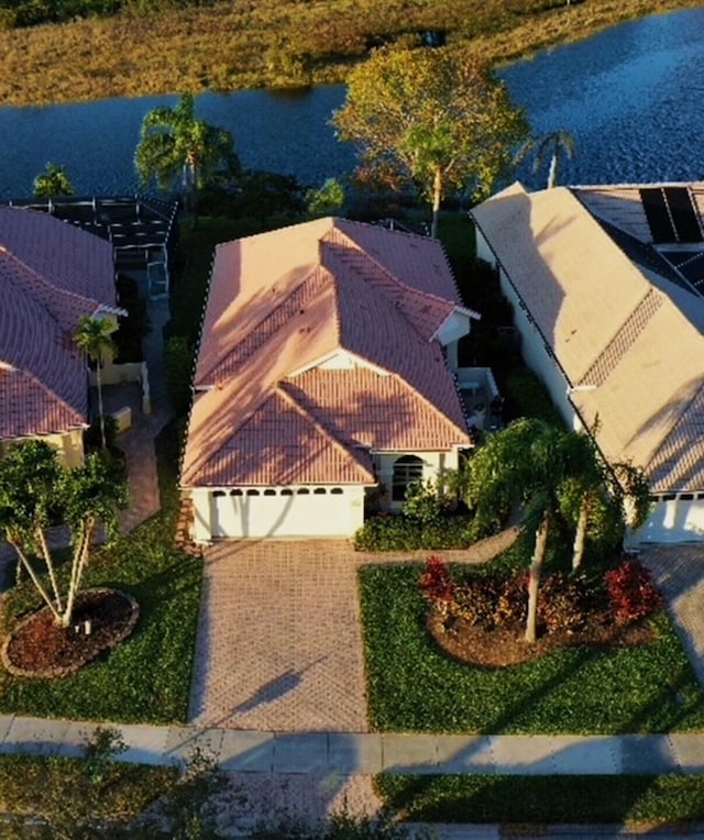 birds eye view of property featuring a water view