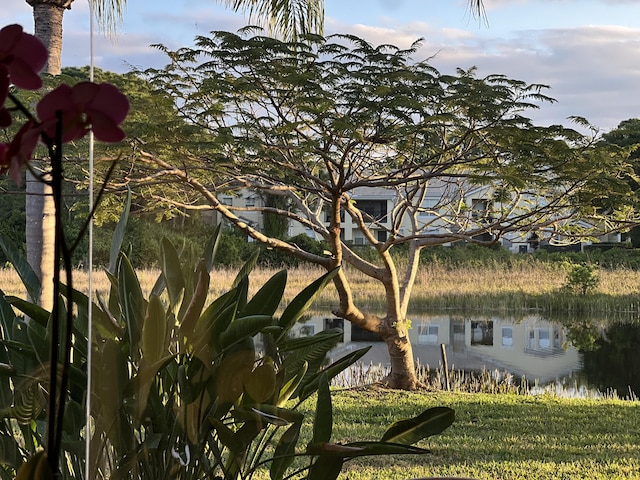 view of side of home with a water view
