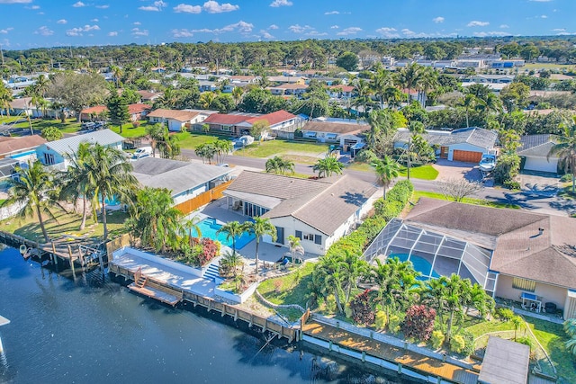 bird's eye view featuring a water view and a residential view