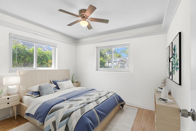 bedroom featuring ceiling fan and wood finished floors