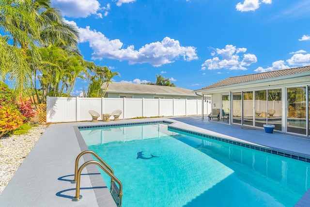 view of pool with a fenced backyard, a fenced in pool, and a patio