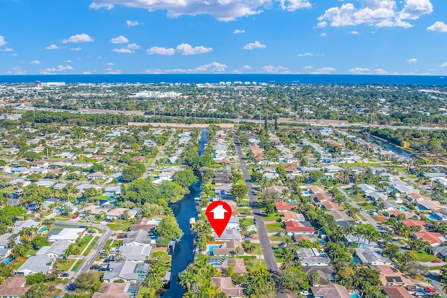 aerial view with a water view and a residential view