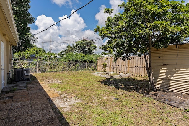 view of yard with a fenced backyard and cooling unit