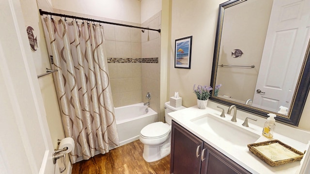 bathroom featuring vanity, wood finished floors, toilet, and shower / bathtub combination with curtain