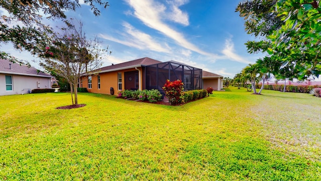 view of yard featuring a lanai