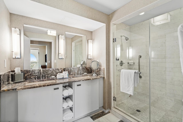 bathroom featuring a stall shower and vanity