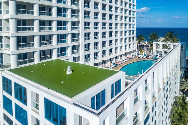 view of swimming pool with a water view