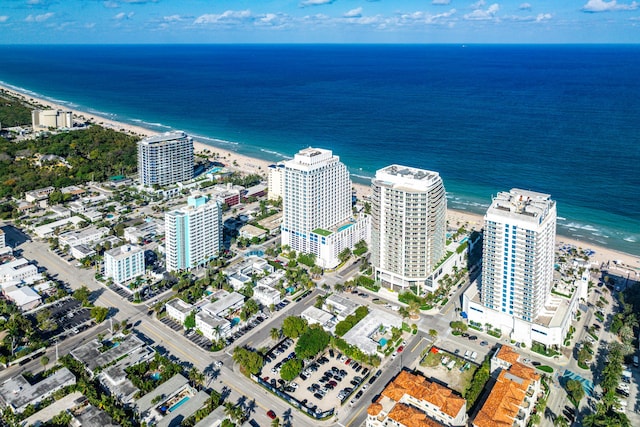 aerial view with a beach view, a water view, and a city view