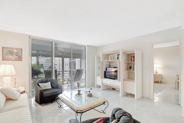 living area featuring light tile patterned floors and a wall of windows