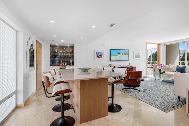 bar featuring indoor wet bar, visible vents, and recessed lighting