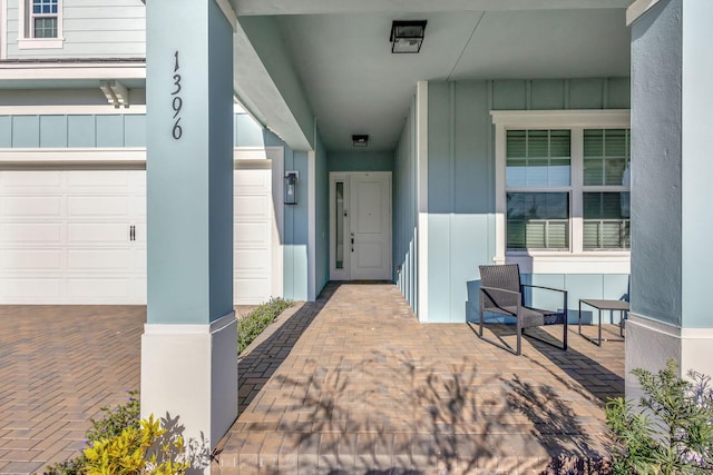 1396 Bushel Creek Xing, Loxahatchee, FL 33470 - doorway to property featuring board and batten siding