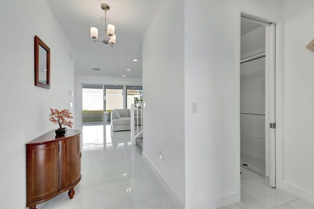 1396 Bushel Creek Xing, Loxahatchee, FL 33470 - hallway featuring light tile patterned floors, a chandelier, baseboards, and recessed lighting