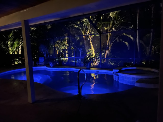 view of pool featuring an in-ground hot tub and a patio area
