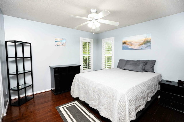 bedroom featuring wood finished floors, baseboards, and ceiling fan