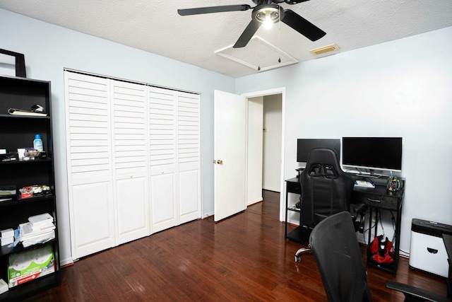 office featuring ceiling fan, wood finished floors, and a textured ceiling
