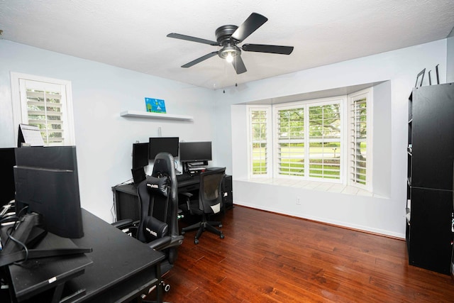 office with ceiling fan, wood finished floors, healthy amount of natural light, and baseboards
