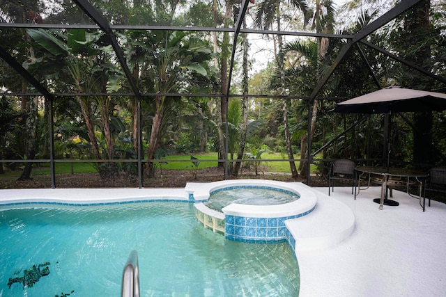 view of swimming pool with glass enclosure, a patio, and a pool with connected hot tub