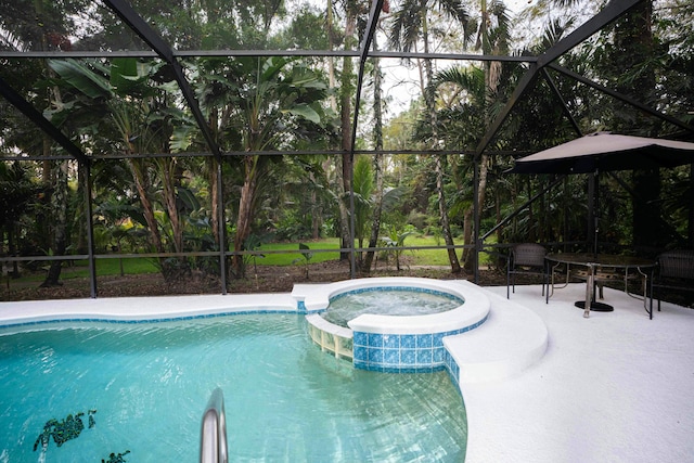 view of swimming pool with glass enclosure, a pool with connected hot tub, and a patio