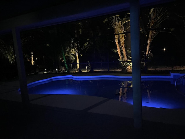 pool at twilight with an outdoor pool
