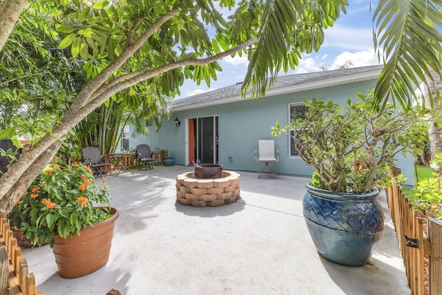 view of patio / terrace featuring an outdoor fire pit