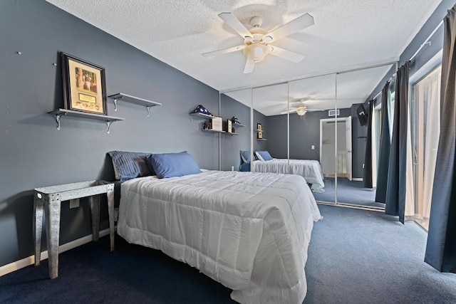 bedroom with a textured ceiling, ceiling fan, carpet, and baseboards