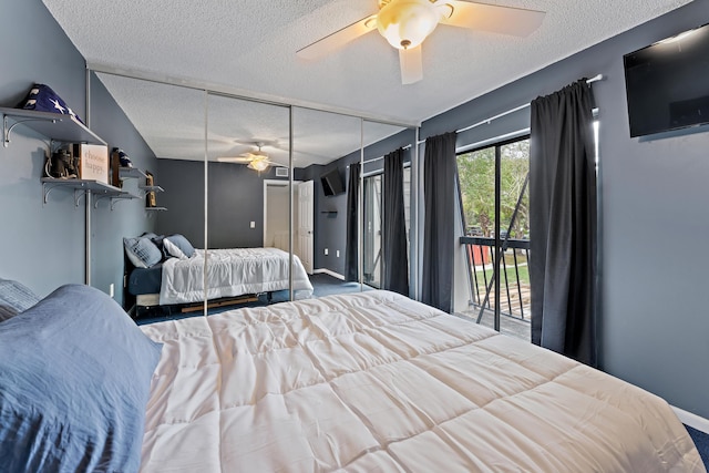 bedroom featuring a ceiling fan, a textured ceiling, and baseboards