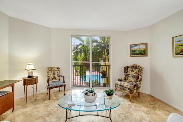 sitting room featuring baseboards