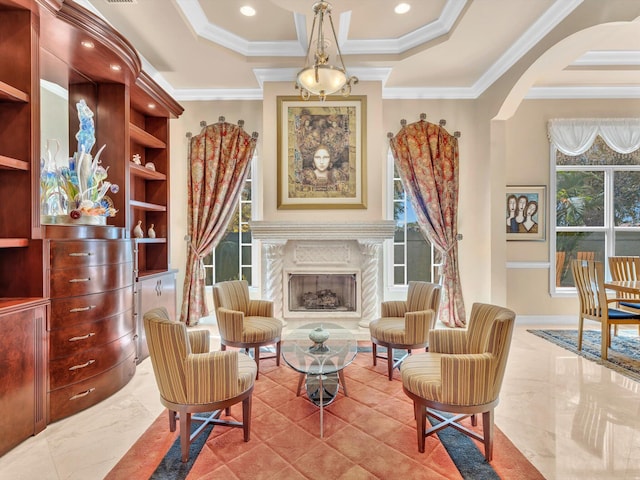 living area with recessed lighting, built in shelves, marble finish floor, and ornamental molding