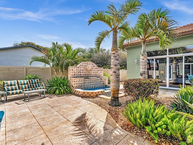 view of patio / terrace featuring fence