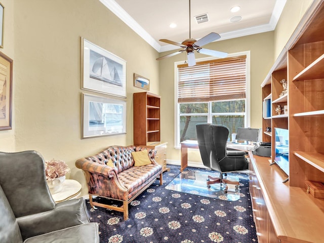 office space with baseboards, a ceiling fan, visible vents, and ornamental molding