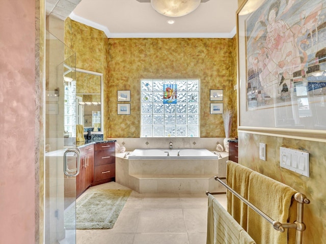 full bath featuring vanity, a shower stall, crown molding, a garden tub, and tile patterned floors