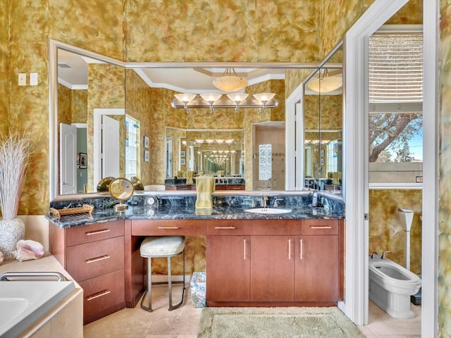 bathroom with a washtub, ornamental molding, vanity, and tile patterned flooring