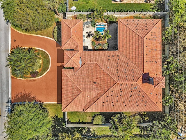 3934 Sherwood Blvd, Delray Beach, FL 33445 - mediterranean / spanish home with a tiled roof, curved driveway, a front lawn, and stucco siding